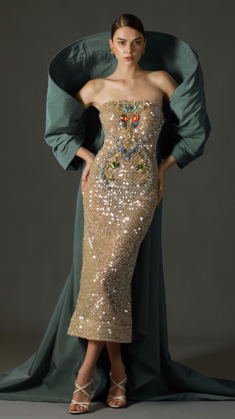 Gold sequin strapless evening gown with emerald draped overlay by Barrage Paris